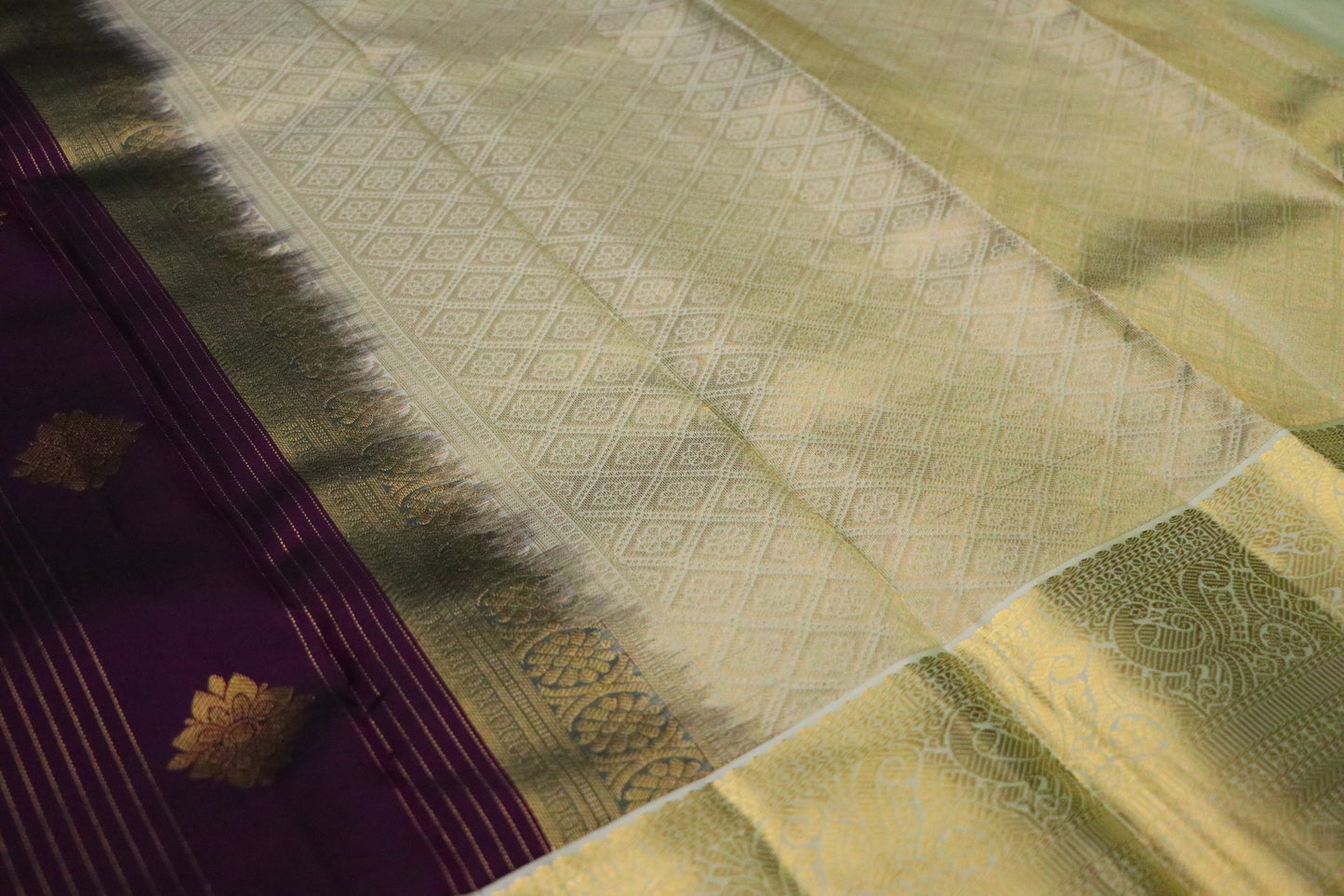 Kanchi Silk-Body-aubergine purple with gold zari buttas and fine vertical gold lines- Border-Soft antique gold