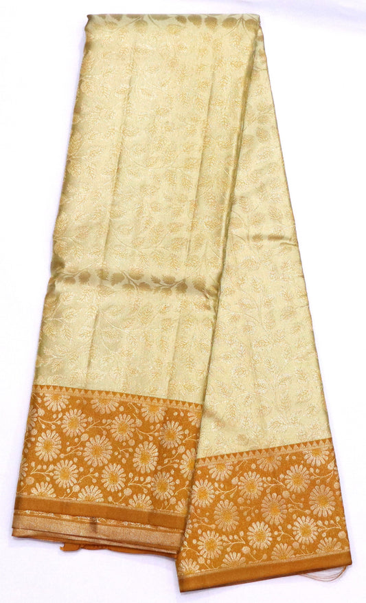 Kanchi Soft Silk Saree – Pale Butter Cream with Mustard Gold Border & Floral Butta