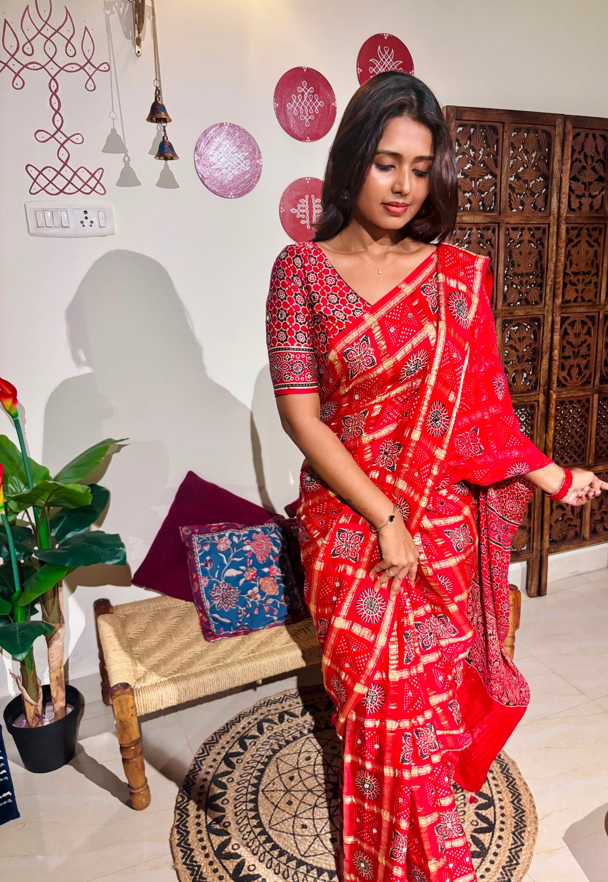 Red Bandhini Gharchola saree with mirror work and Gota Patti embellishment