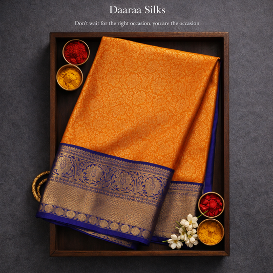 Kanchi Silk-jacquard floral jaal-Rich marigold orange with Royal cobalt blue border and pallu