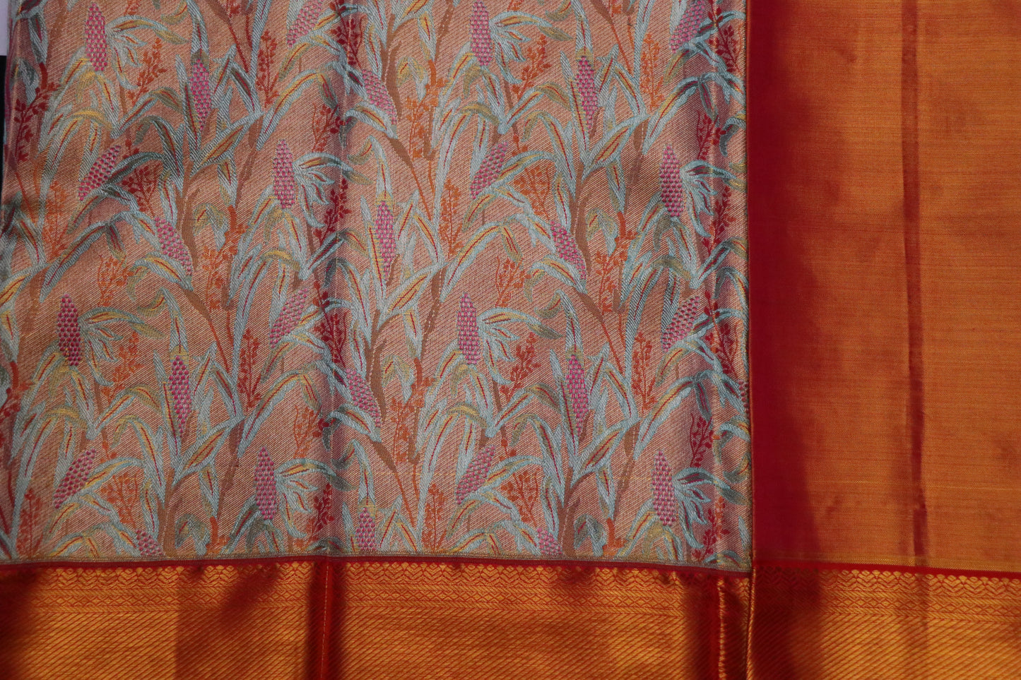 Kanchi Silk-Body-Soft peach–coral base-Mint green leafy motifs-Palu-Border-Rich burnt orange