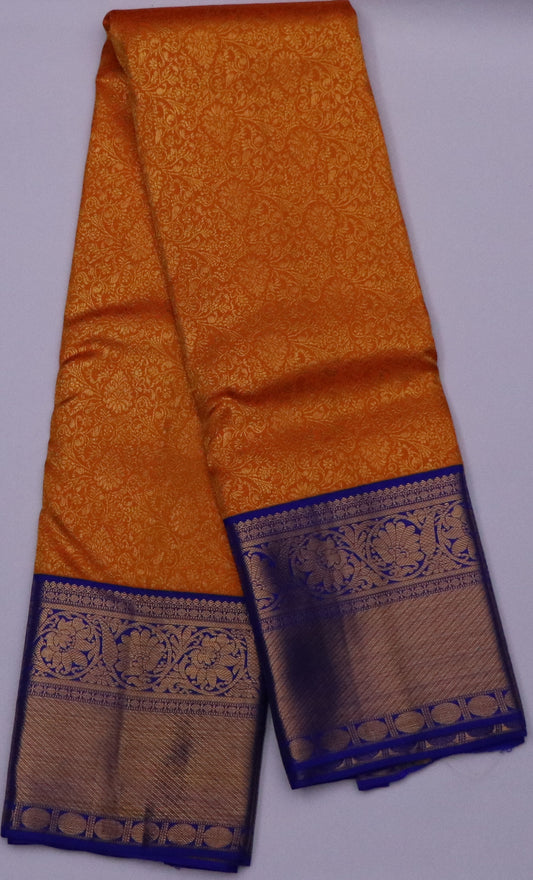 Kanchi Silk-jacquard floral jaal-Rich marigold orange with Royal cobalt blue border and pallu