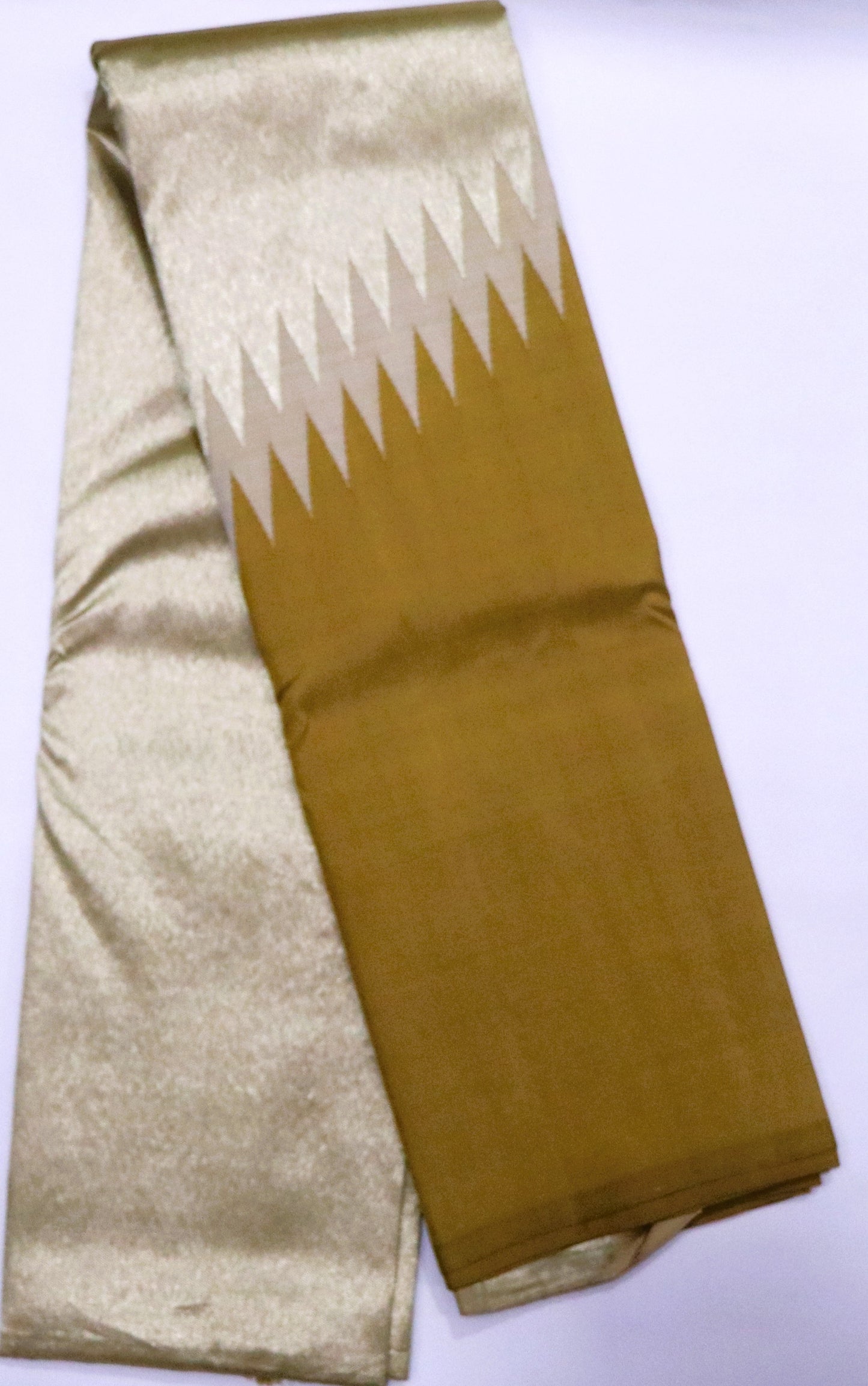Kanchi Silk-Rising Temple Border-Body-Pale Gold-Warm Mustard Gold / Antique Gold -Pallu & Lower Section-Ivory–Beige Accents (Zigzag Pattern)