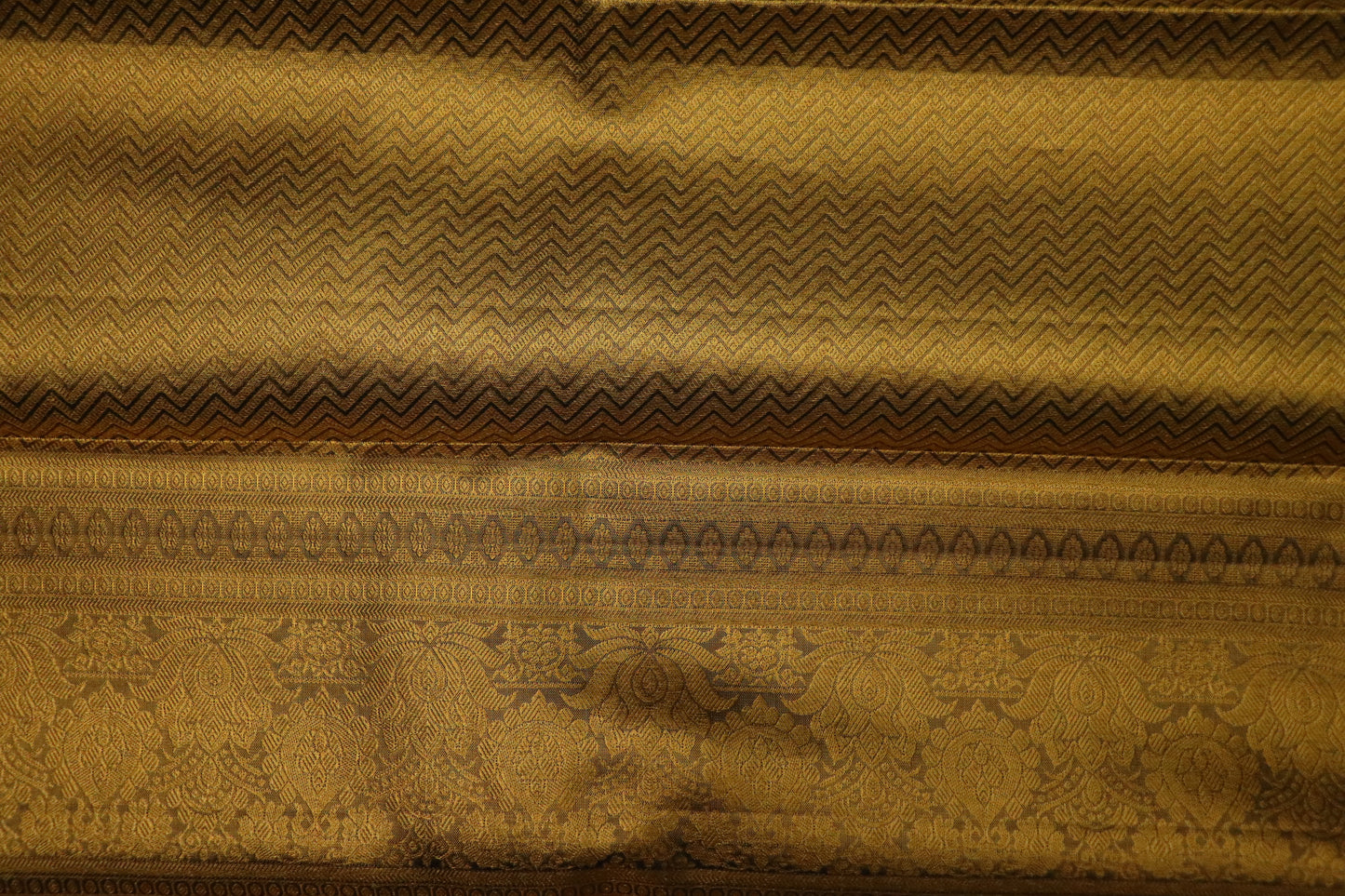 Kanchi Silk-Body-soft antique gold-cream-gold and honey-gold-self-jacquard floral pattern-deep antique gold zari with dark navy/ink-blue accents