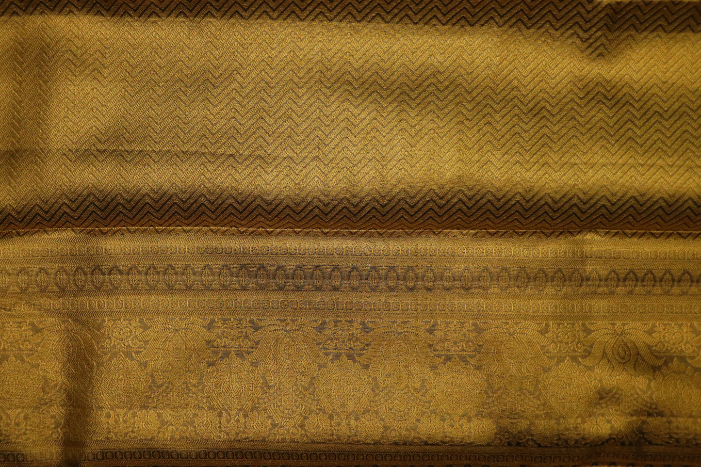 Kanchi Silk-Body-soft antique gold-cream-gold and honey-gold-self-jacquard floral pattern-deep antique gold zari with dark navy/ink-blue accents