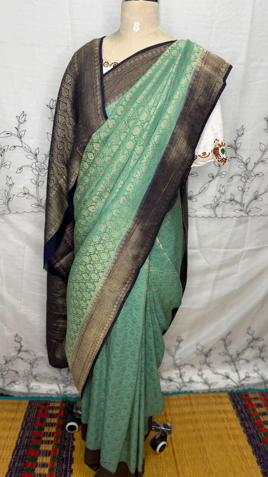 Sea green Semi Banarasi georgette saree with navy blue Banarasi-inspired zari border, Daaraa Silks