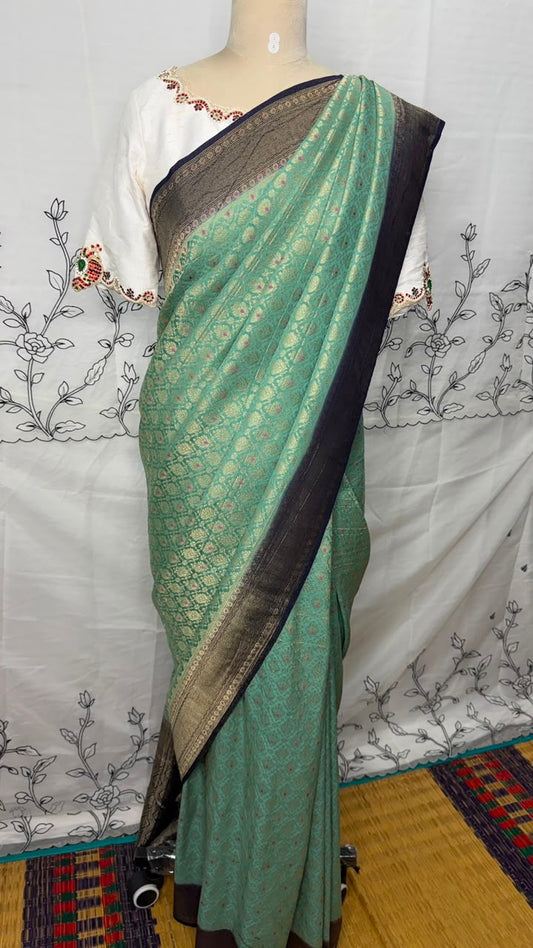 Sea green Semi Banarasi georgette saree with navy blue Banarasi-inspired zari border, Daaraa Silks